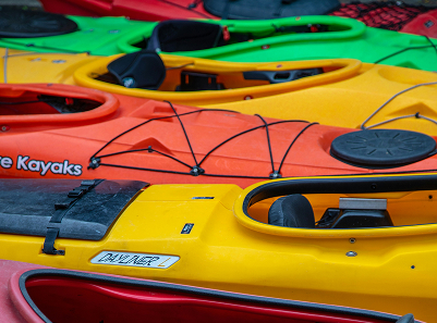colorful kayayks in a row